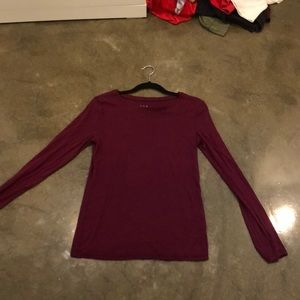 A burgundy long sleeve shirt